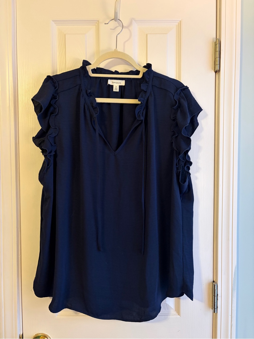 Ruffled Sleeveless Navy Blouse with Tie Detail